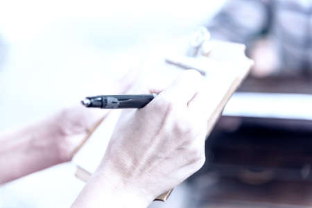Detail of Notepad to write the orders of the Coffee bakery shop.の写真素材