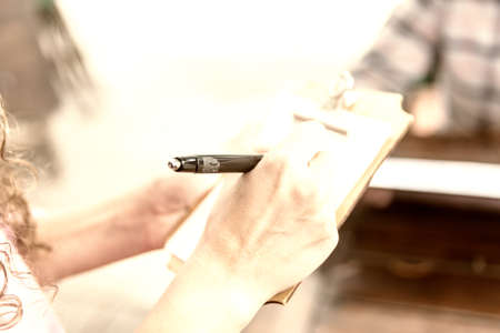 Detail of Notepad to write the orders of the Coffee bakery shop.の写真素材