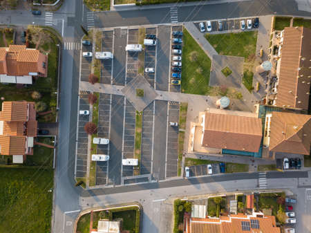 Aerial view fron drone about a parking with cars.の写真素材