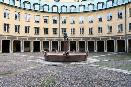 Statue of a woman in a inner park place in de middle of a building in Stockholmのeditorial素材
