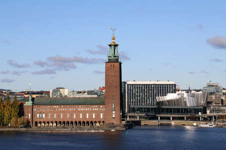Stadshuset in Stockholm near the water, with a blue sky in the winterのeditorial素材