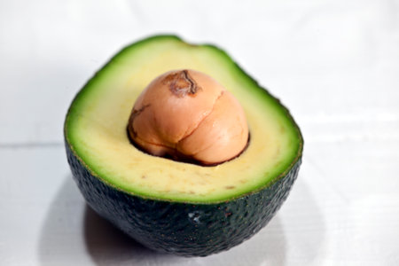 Avocado cut in half on a white background, close-up