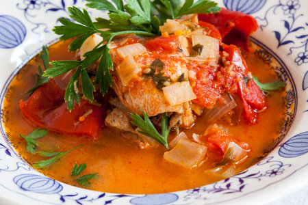Fish stew with vegetables and herbs close-up on a plate. horizontalの写真素材