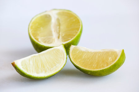 Lime slices isolated on white background. Selective focus and shallow DOF.