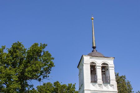 Old church belfry and treeの写真素材