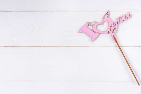 Love sign on white wooden backgroundの写真素材