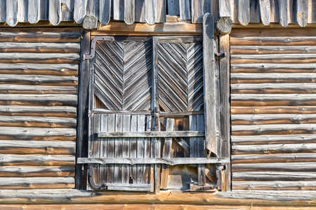 Old barn wooden doors at bright sunlightの写真素材