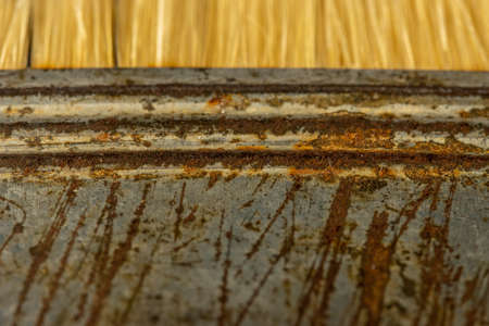 Old rusty paint brush bristle closeupの写真素材