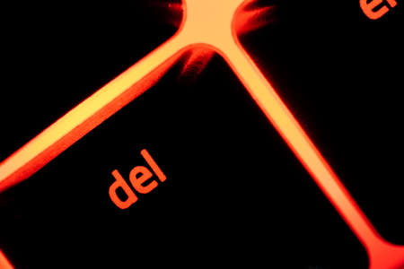 Red illuminated keyboard delete key closeupの写真素材