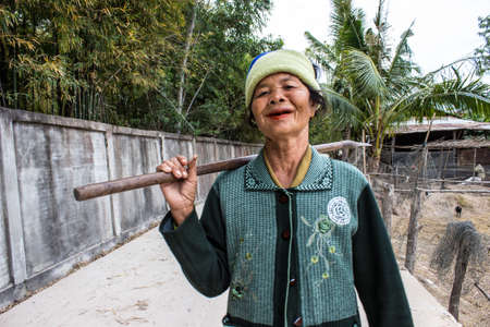 SURIN THAILAND-JANUARY 7  Unidentified woman stand in a good mood, smiling and happy on the road on January 7, 2013 in Surin, Thailand のeditorial素材