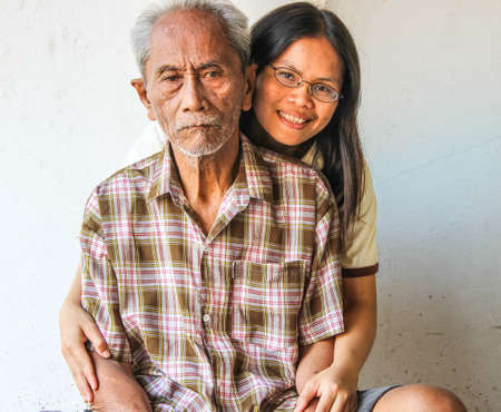 SURIN THAILAND-JANUARY 22  father and daughter who are not given a good mood, smiling and happy at home on January 22, 2013 in Surin, Thailand のeditorial素材