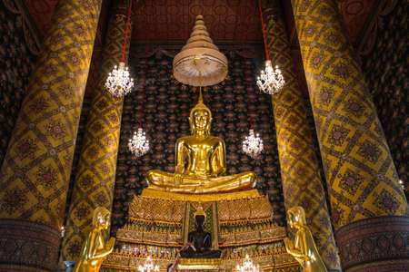 Golden Buddha statue in a Buddhist templeのeditorial素材