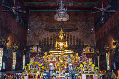 Golden Buddha statue in a Buddhist templeのeditorial素材