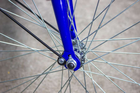 Front wheel of the bike with a cement background.の写真素材