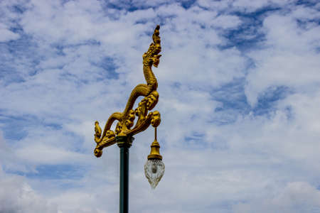 Dragon lamp with sky and clouds as background.の写真素材