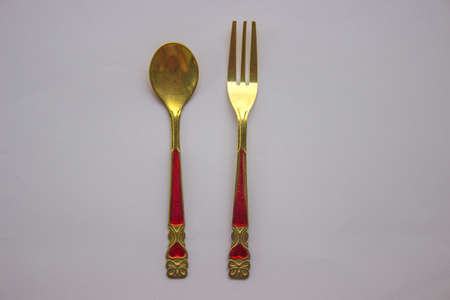 fork and spoon on a white background isolatedの写真素材