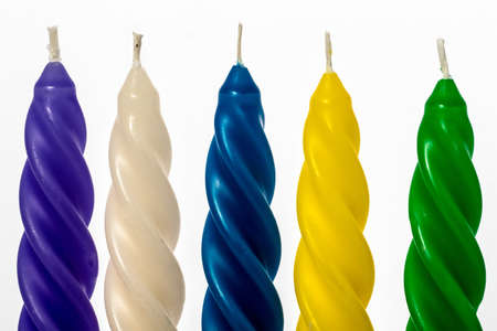 spiral-shaped candles on white backgroundの写真素材