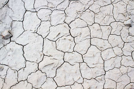 Land with dry, cracked earth. without lifeの写真素材