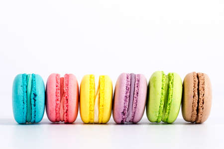 Sweet and colourful french macaroons or macaron on white background, Dessert.の写真素材