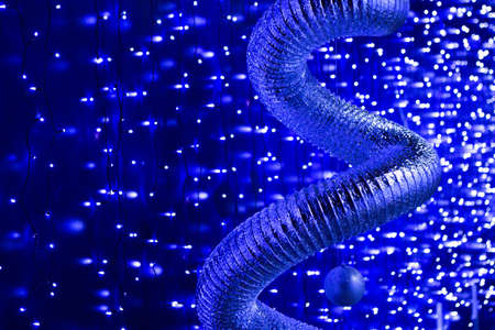 Christmas lights frame on dark blue background with copy spaceの写真素材