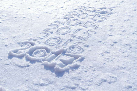 new years date 2017 written in fresh powder snow, Christmas backgroundの写真素材