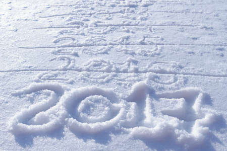 new years date 2017 written in fresh powder snow, Christmas backgroundの写真素材