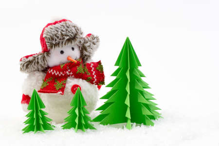 Christmas decoration toy snowman with origami tree isolated on white backgroundの写真素材