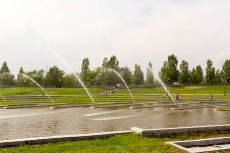 The fountain on the lake in the park.の写真素材