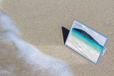 Mirror on the sand with the reflection of the sea and Islands.