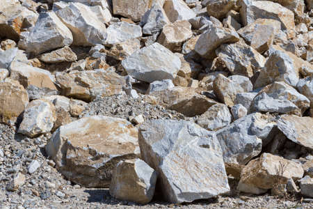 Placer of large stones in a stone quarry close-up. Mining industry.