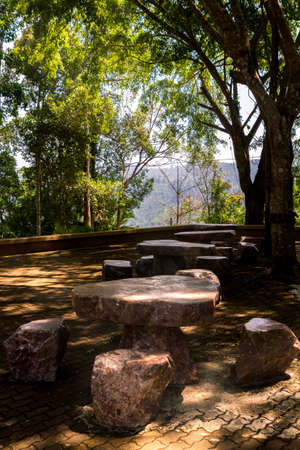 one table and chairs which is made by stone in ancient time.の写真素材
