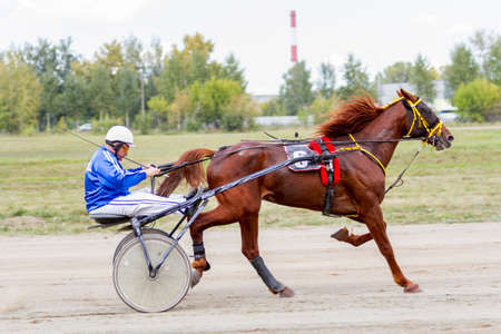Russia, Novosibirsk, September 5, 2015: Horse racing at the racetrack. City competitions.のeditorial素材
