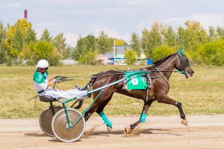 Russia, Novosibirsk, September 5, 2015: Horse racing at the racetrack. City competitionsのeditorial素材