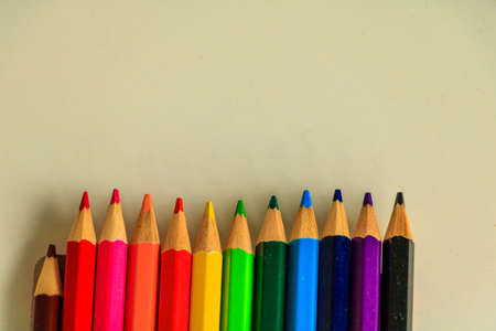 Wooden colorful pencils on white table.の写真素材
