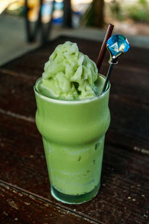 Green Tea Smoothie on wooden table.の写真素材