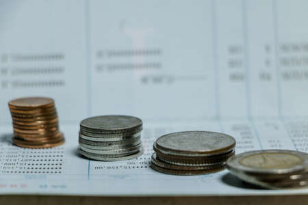 Coin on passbook by blur backgrond.の写真素材