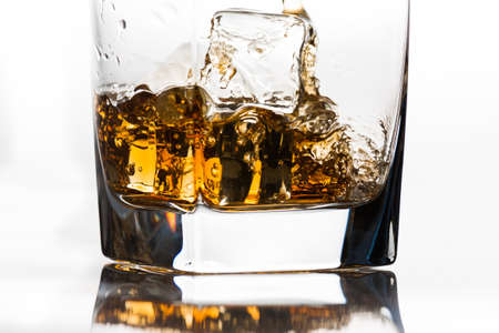 Whiskey on the rocks being pouredの写真素材