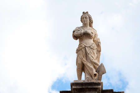 Woman rising above an anchor statue on top of St  Blaise churchの写真素材