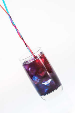 Mixing a colorful drinkの写真素材