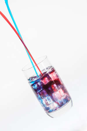 Mixing a colorful cold drinkの写真素材
