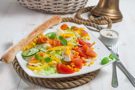 Fresh salad with breadstick close-upの写真素材