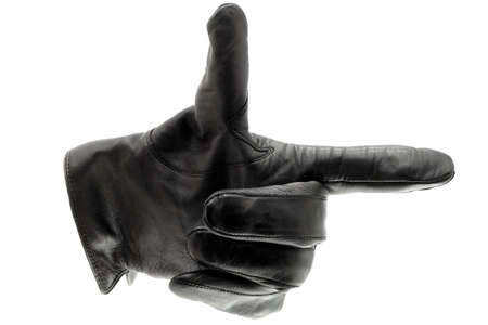 Black leather glove pointing rightの写真素材