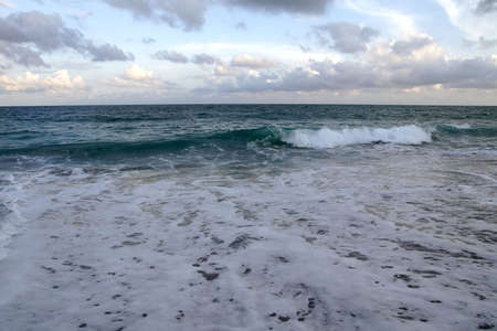 Ocean and cloudy skies at dusk