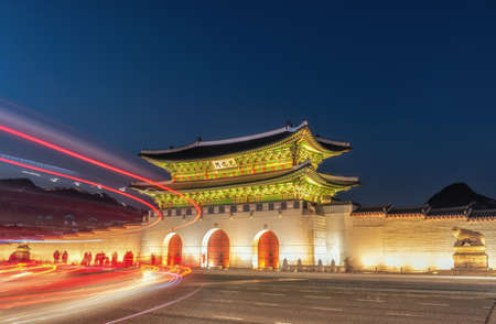 Gyeongbokgung Palace At Night In South Korea, with the name of the palace 'Gyeongbokgung' on a signのeditorial素材