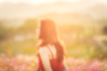 blurred lifestyle woman enjoy in flower park, tulip, white pink cosmos treeの写真素材