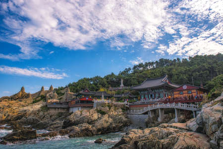 Haedong Yonggungsa Temple and Haeundae Sea in Busan, South Korea.の写真素材