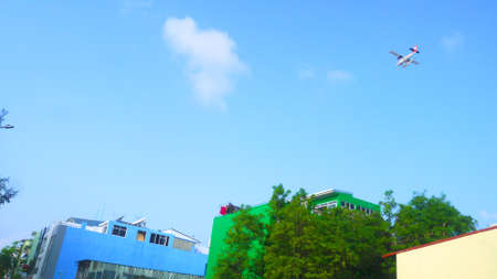 The plane fly in the blue sky in Maldives