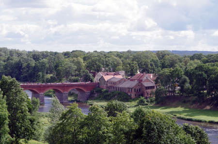 Old brick bridge over the Venta river in Kuldiga (Latvia, Europe)の写真素材