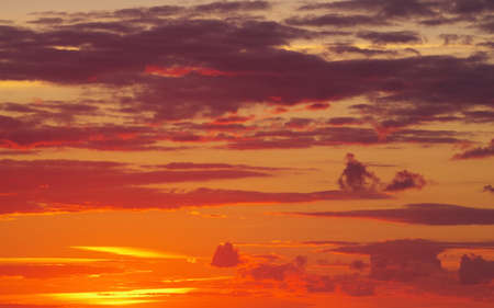 Beautiful sea sunset with nice lighted cloudsの写真素材