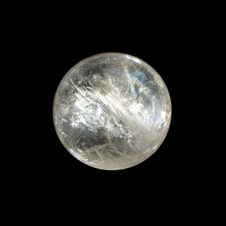 Rock crystal ball on black background